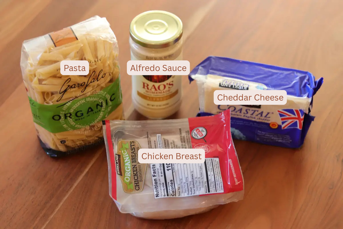 Labeled ingredient photo of pasta, alfredo sauce, cheese, and chicken breast. 