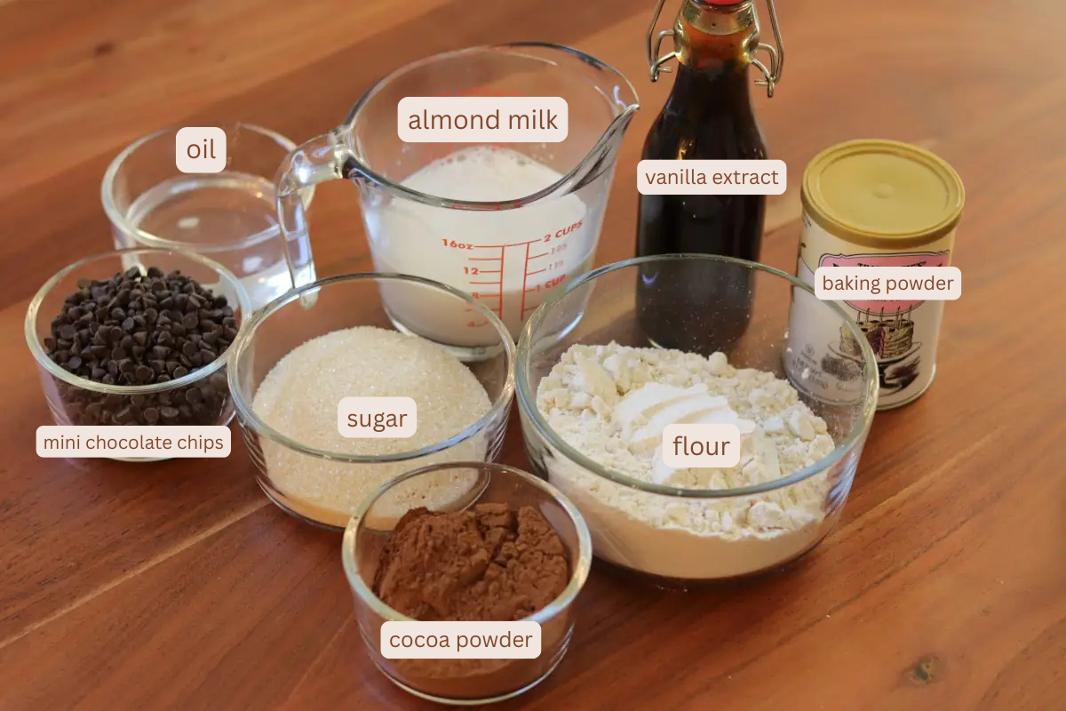 labeled ingredient photo for fudgy brownies. Contains mini chocolate chips, oil, almond milk, sugar, flour, cocoa powder, vanilla extract, and baking powder.