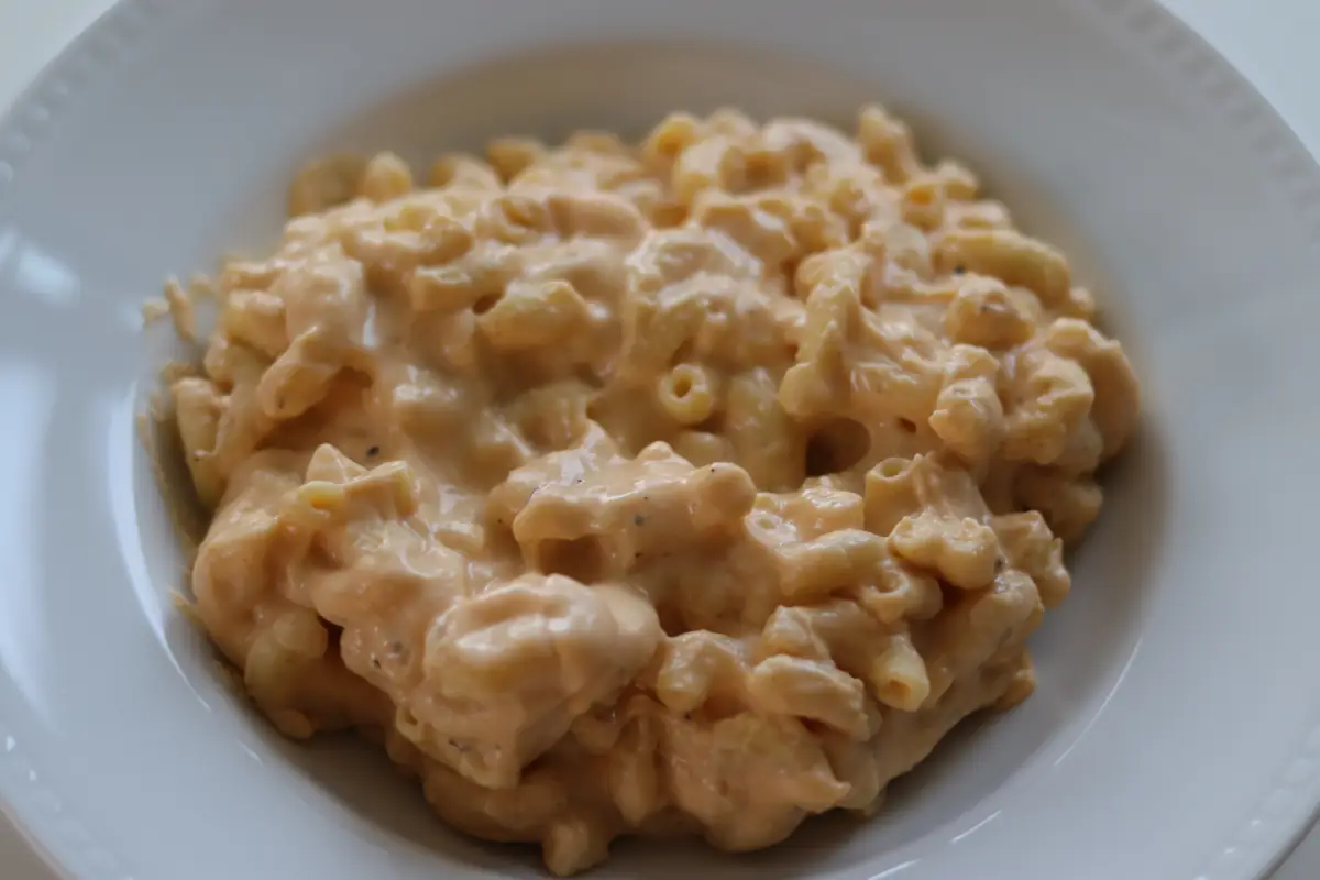 Crockpot Mac and Cheese that is done cooking on a white plate