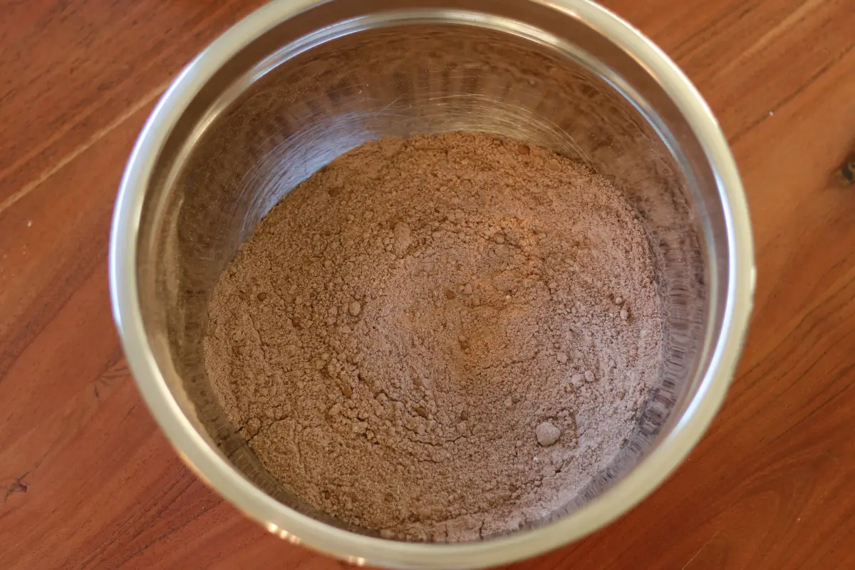 Dry ingredients for the brownies in a mixing bowl.