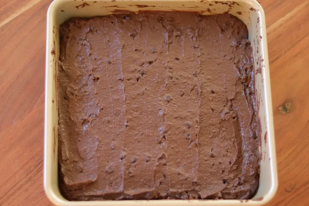 Fudgy brownie batter in an 8x8 inch pan.