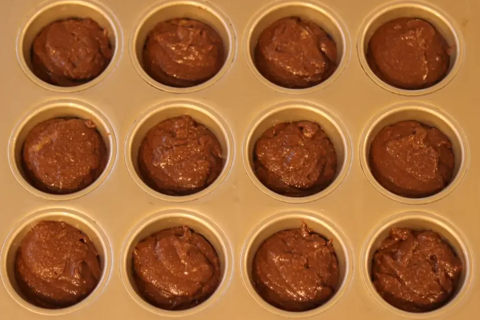 High Fiber Brownie batter in a muffin tin.