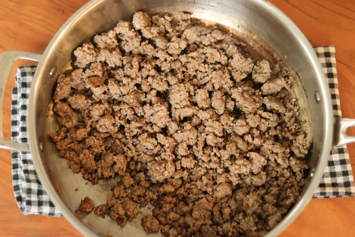 Browned beef in a pan.