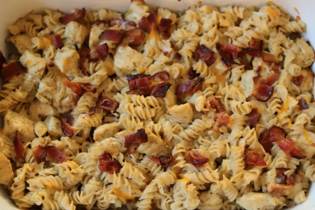 Ranch chicken alfredo bake after it has been baked, in a white baking pan.