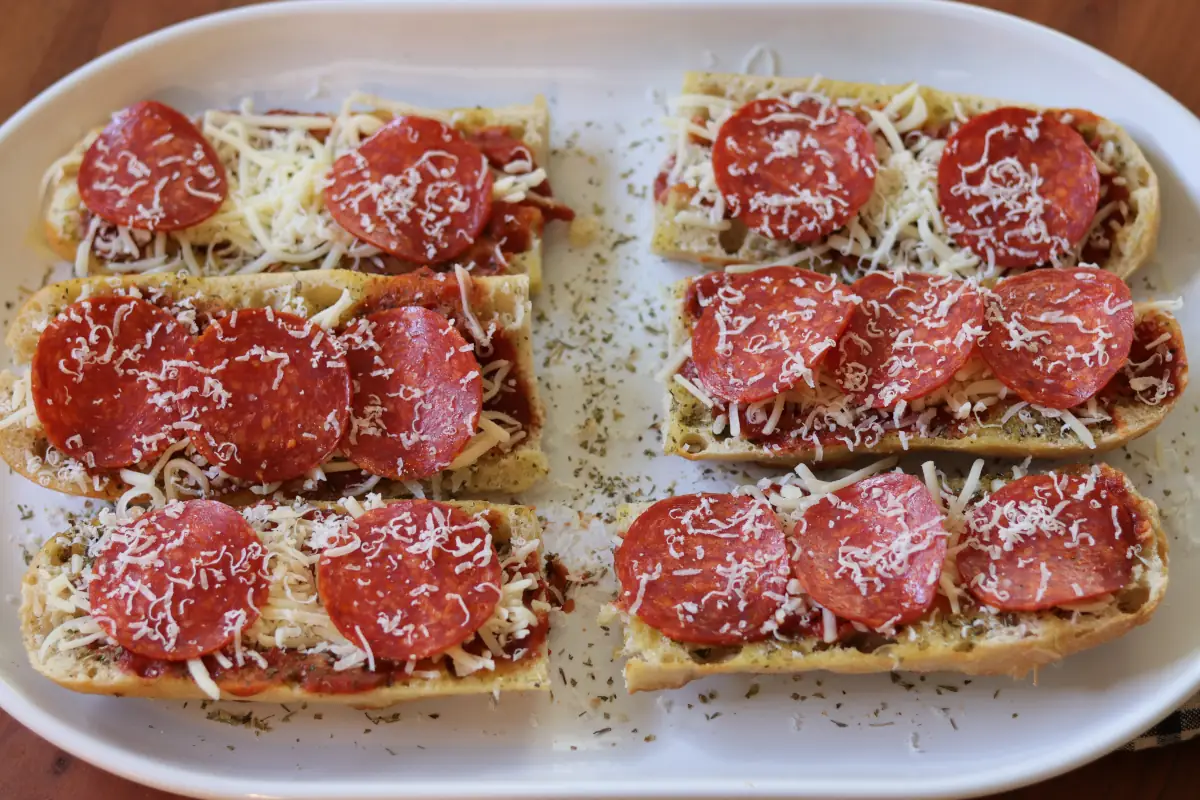 French bread that has been topped with pizza sauce, cheese, and pepperoni. 