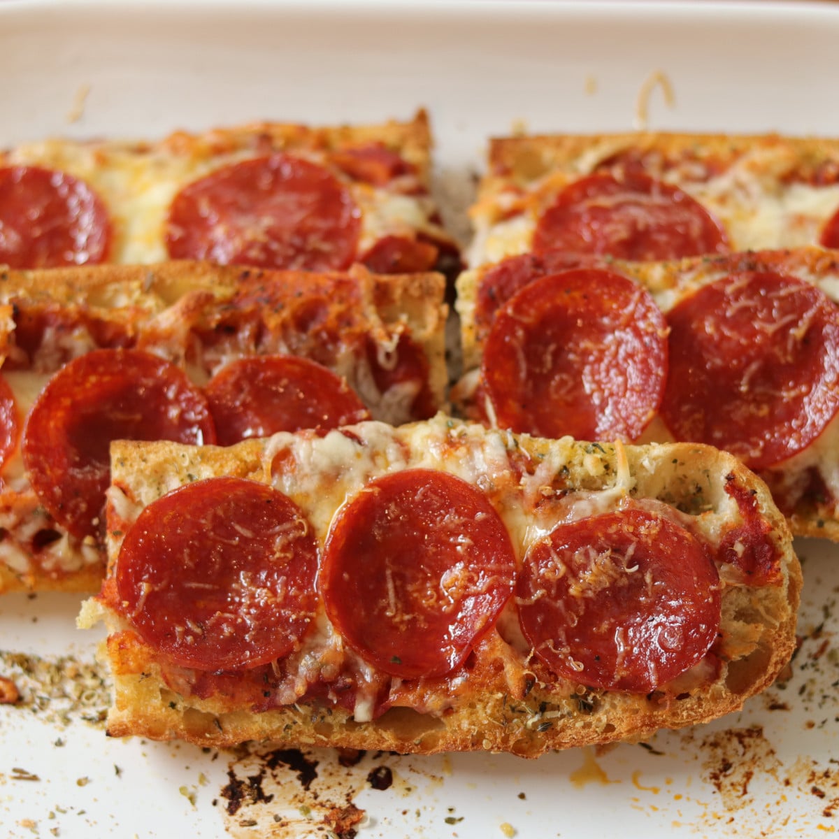 Pizza boats on a platter. 