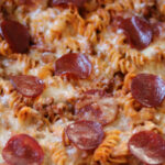 Close up photo of pizza pasta casserole.