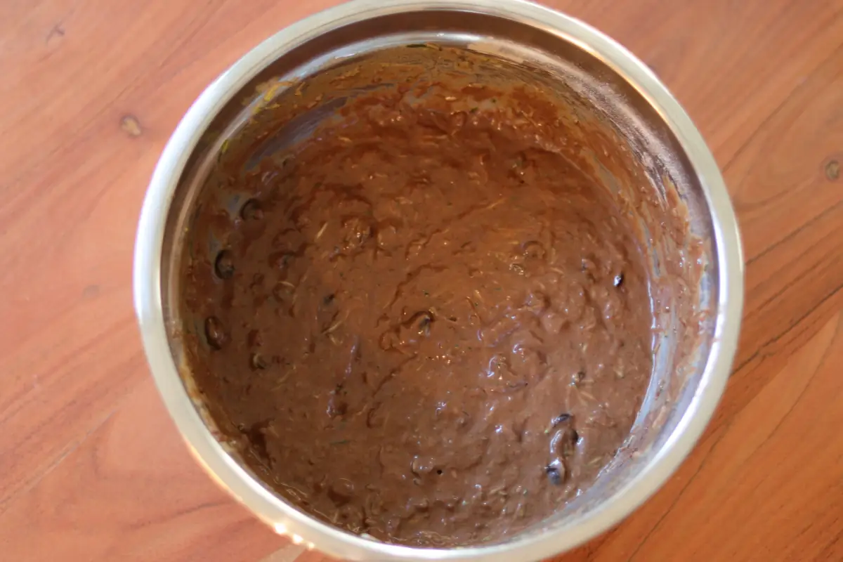 Zucchini muffin batter in a mixing bowl.