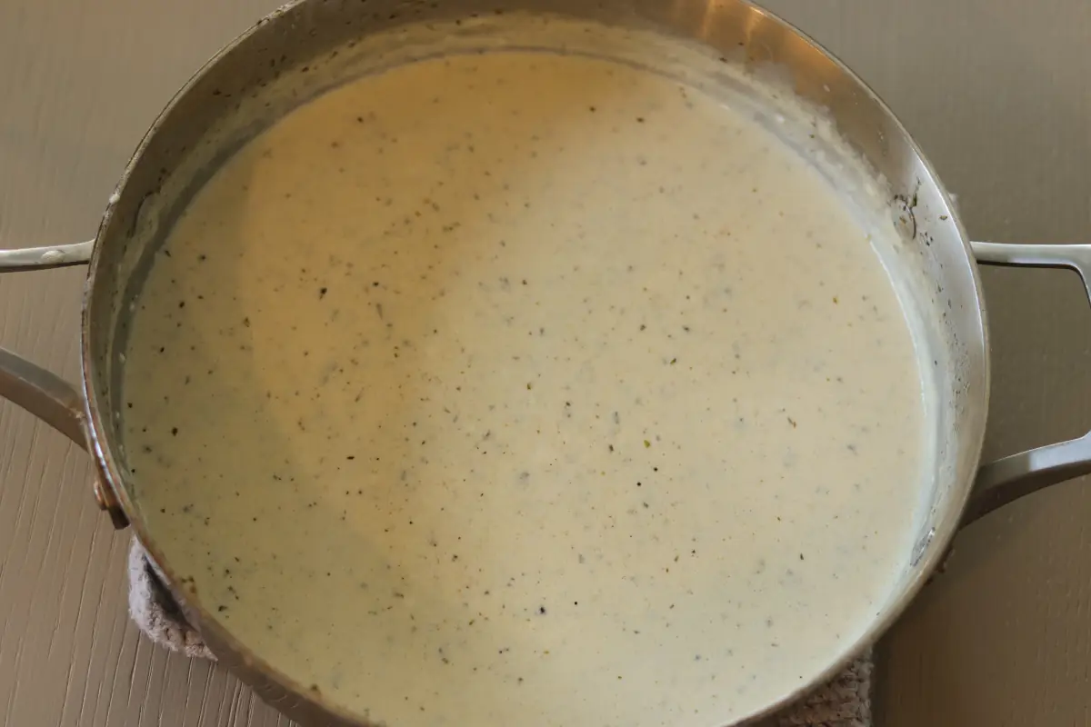 Cheese added to the alfredo sauce for the chicken broccoli alfredo.