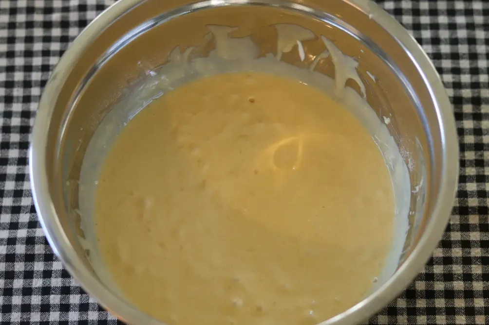 Cake mix batter in a mixing bowl.
