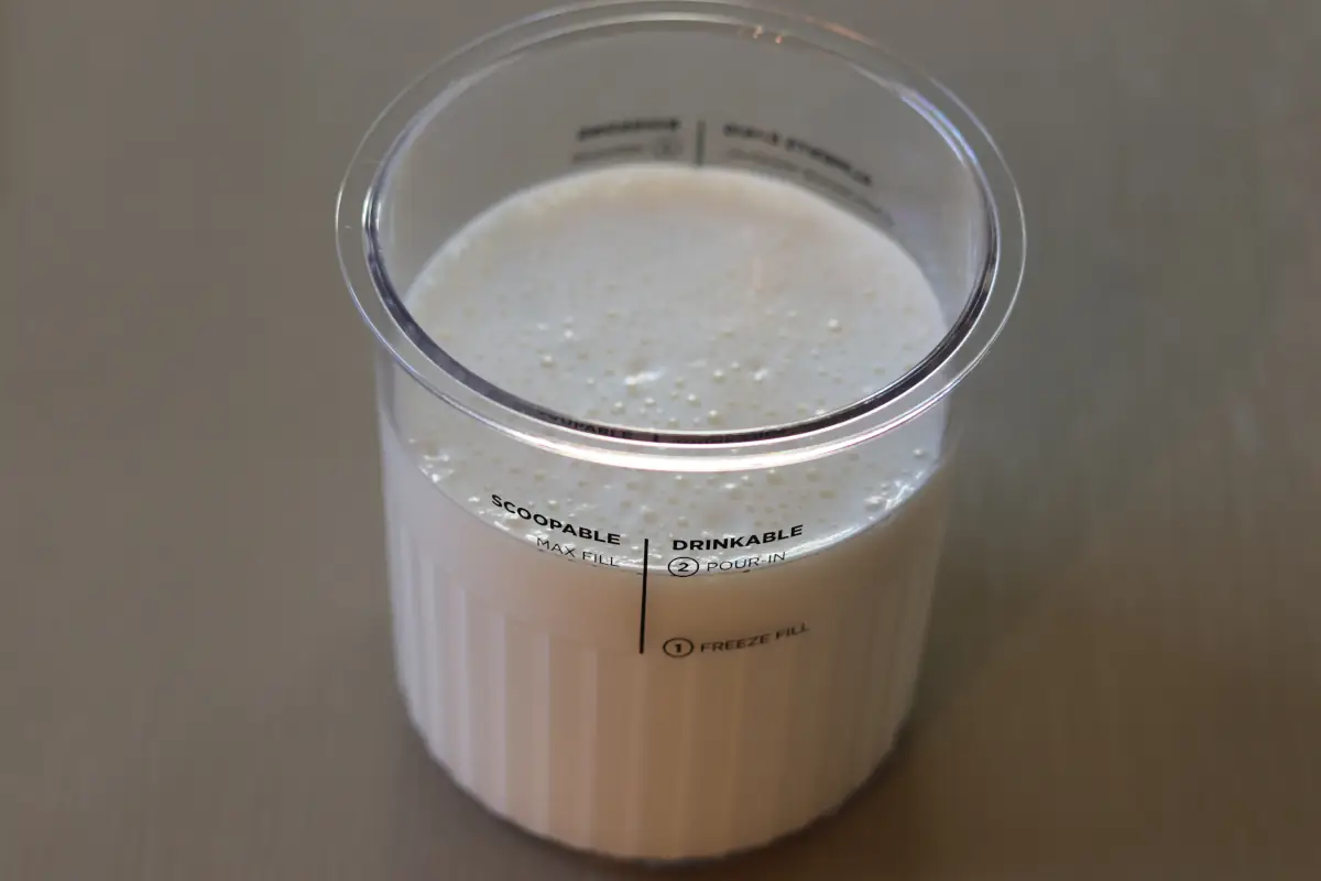 Ninja creami ice cream mixture in a ninja creami container.