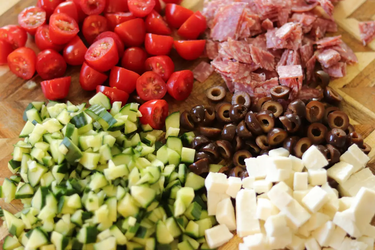 chopped vegetables and cheese for the pasta salad.