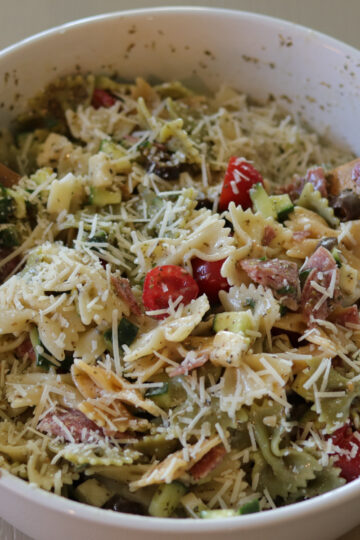 zesty italian pasta salad in a white bowl